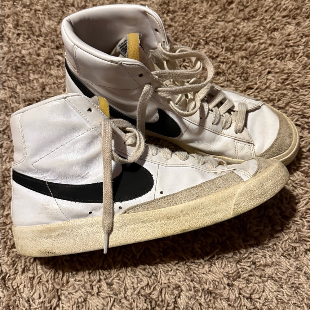 Nike White High-Top Sneakers with Black Swoosh and Yellow Tongue